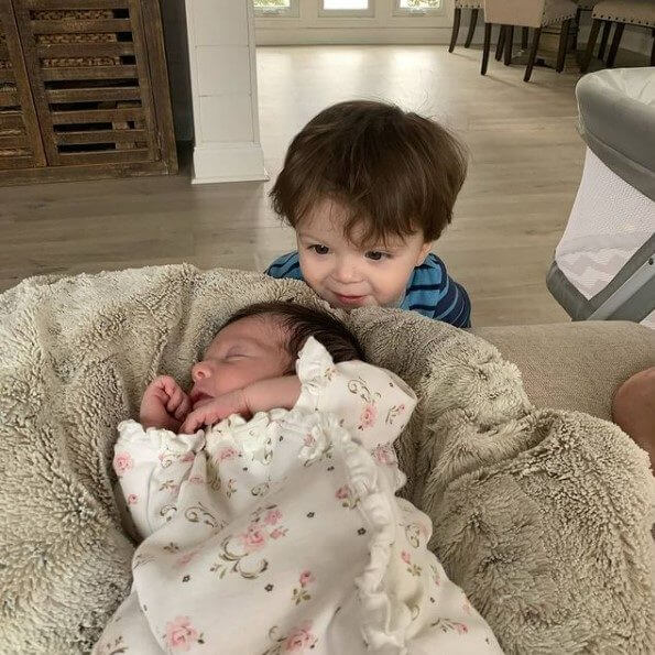 Myles warming up to his baby sister Mackenzie
